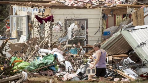 Michelle Light salvages belongings from her home near Salado, Texas, on Wednesday.