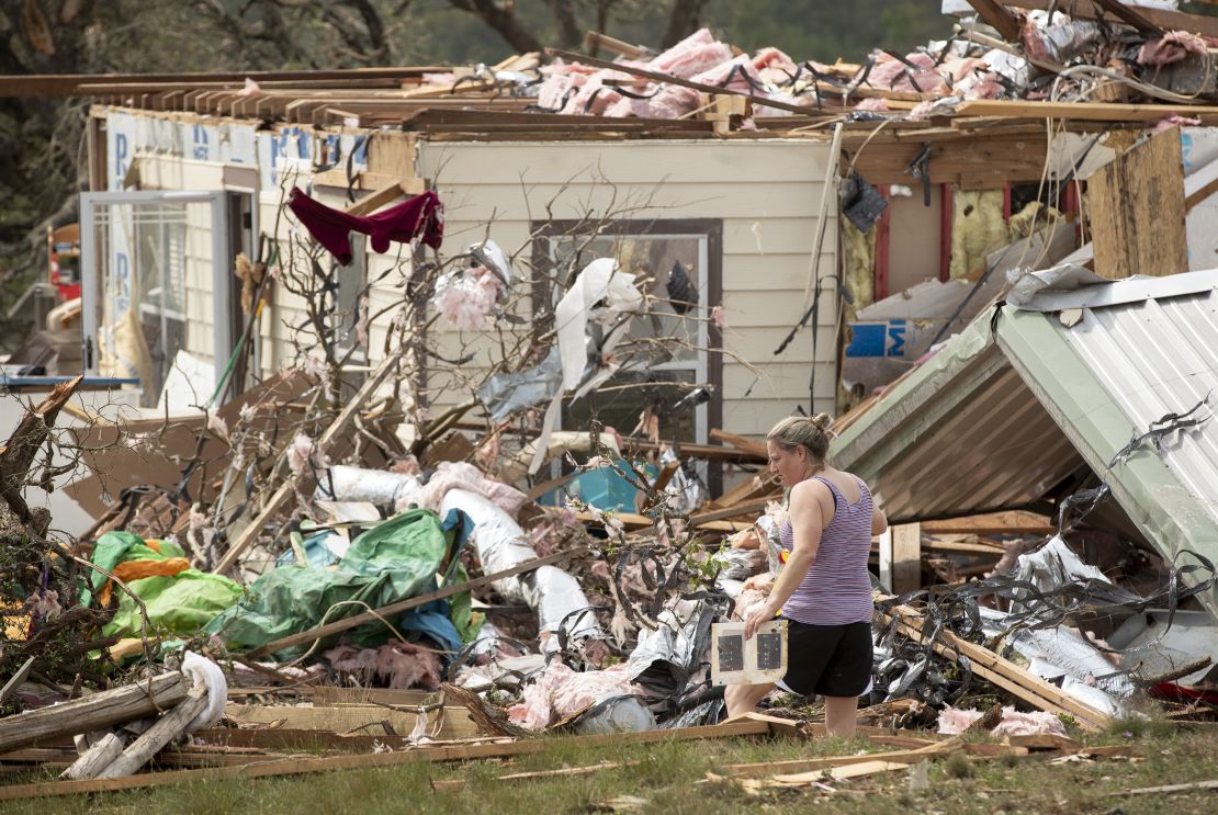 Michelle Light salvages belongings from her home near Salado, Texas, on Wednesday.