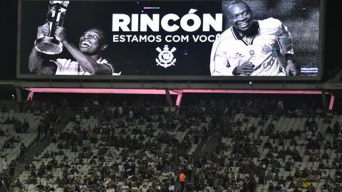 A screen projects an image of former Colombian star midfielder Freddy Rincón reading "Rincón We Are With You" during the Copa Libertadores group stage first leg football match between Brazil's Corinthians and Colombia's Deportivo Cali at the Corinthians Arena in Sao Paulo, Brazil, on April 13, 2022. 