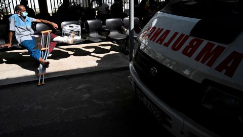 A patient waits for treatment at a hospital as health workers hold a work strike in Colombo on February 9, 2022.