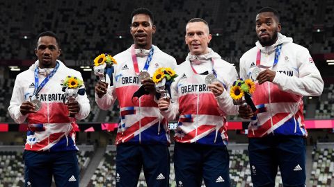 Team GB's Britain's Chijindu Ujah, Zharnel Hughes, Richard Kilty and Nethaneel Mitchell-Blake celebrate on the podium after winning the silver medal at for the men's 4x100m relay event during the Tokyo 2020 Olympic Games.