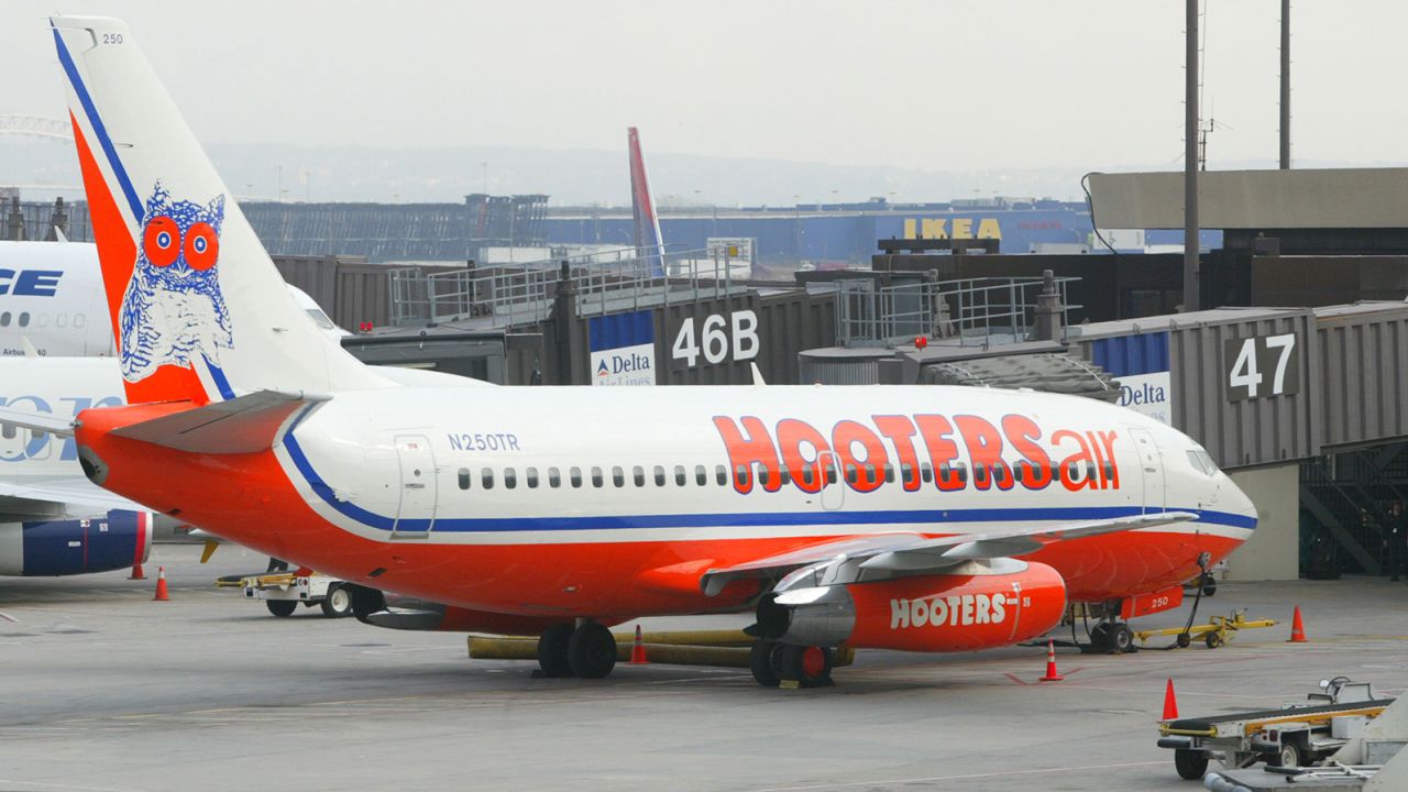 A Hooters plane arrives at Gate 47 for the inauguration of the airline's new service between Newark and Myrtle Beach, South Carolina at Newark Liberty International Airport in Newark, New Jersey, April 3, 2003. 