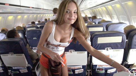 Spin off: "Hooters girl" Hillary Vinson, front, attends to passengers on a 2003 flight.