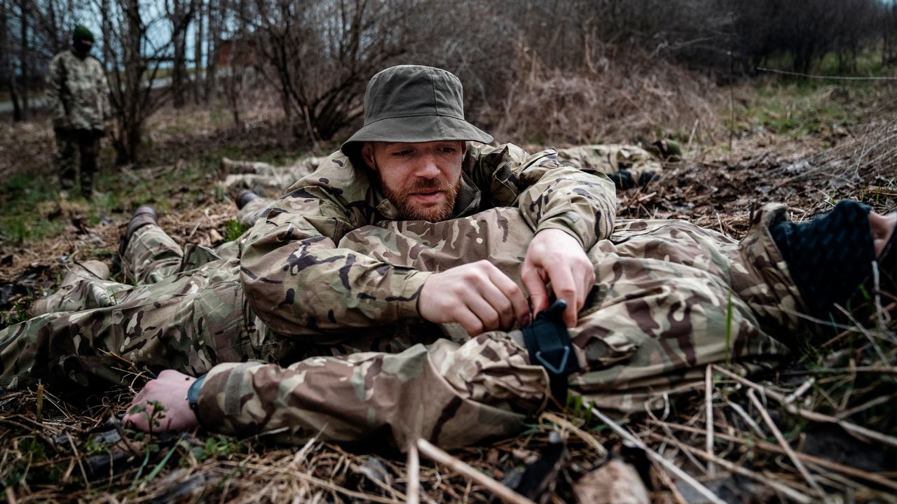 A group of Belarusian dissidents are taught basic survival training skills at the Poland-Ukraine border. The aspiring volunteer fighters want to join the fight for Ukraine.