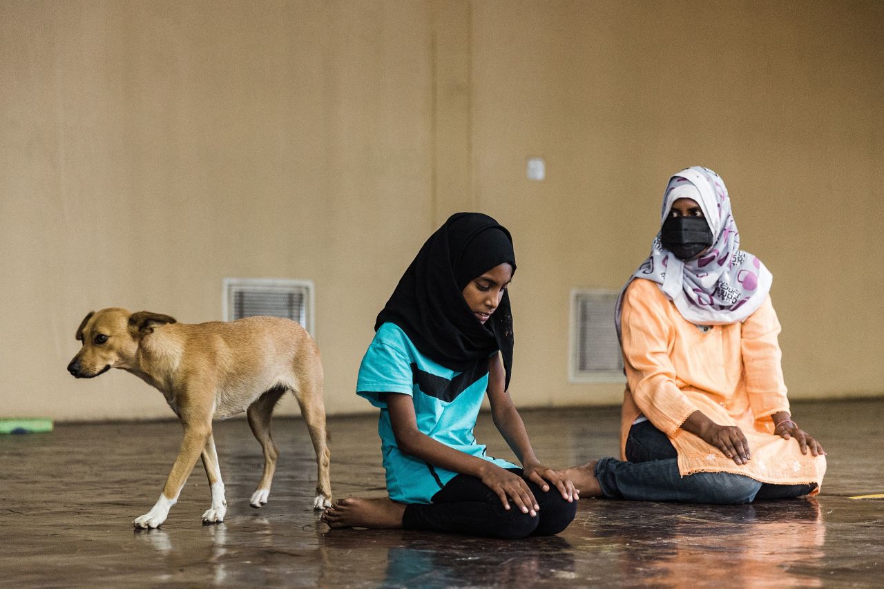 Displaced people from the Phoenix township take part in an afternoon prayer on April 13. They took refuge at the Sastri Park Hall after the flooding.
