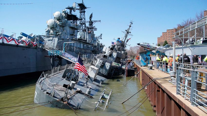 The vintage battleship USS The Sullivans is listing to one side after taking on water at the Buffalo and Erie County Naval & Military Park in Buffalo, N.Y. on Thursday, April 14, 2022. (Derek Gee/The Buffalo News via AP)