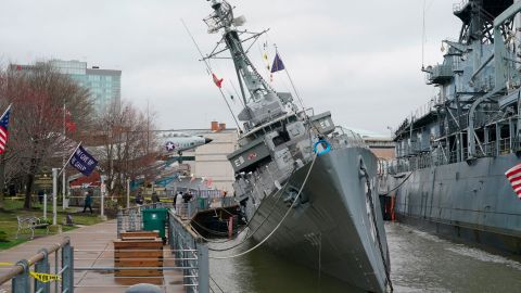 USS The Sullivans is tilting to one side after taking on water.