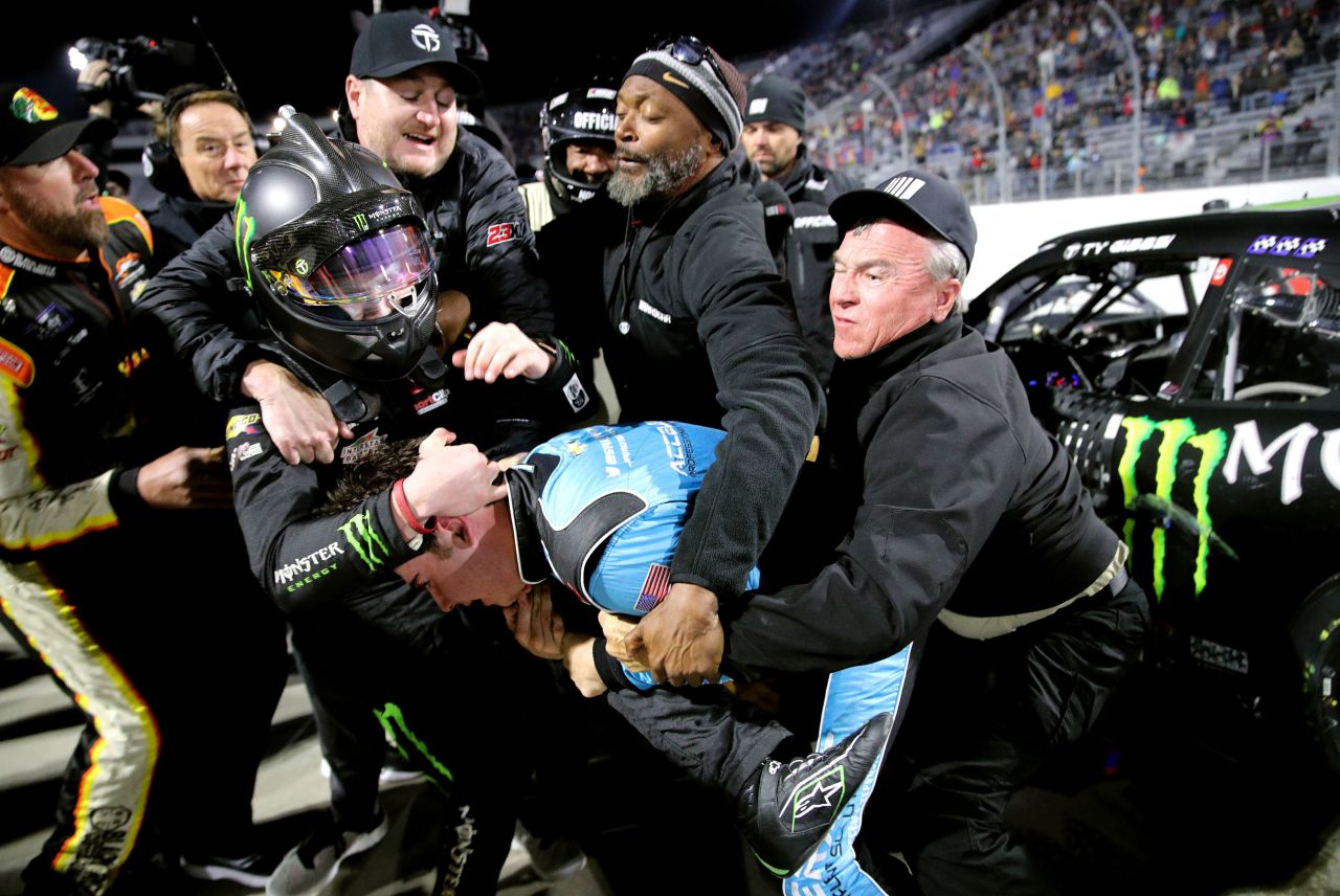 Crew members break up a fight between NASCAR drivers Sam Mayer, bottom right, and Ty Gibbs on Friday, April 8. <a href="https://bleacherreport.com/articles/10032140-video-ty-gibbs-sam-mayer-trade-punches-in-fight-at-nascar-xfinity-series-race" target="_blank" target="_blank">The two tangled</a> after the Xfinity Series race in Martinsville, Virginia.