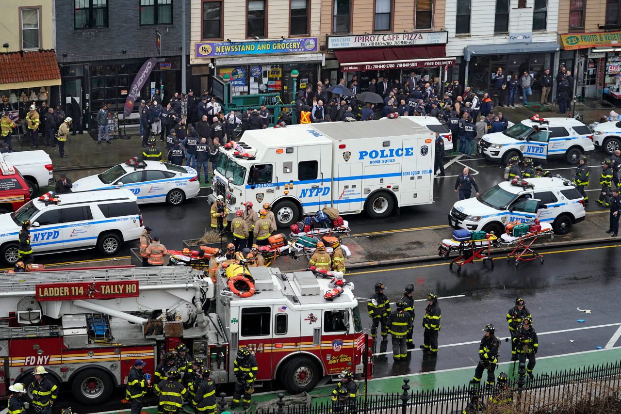 Emergency personnel gather at the entrance of the 36th Street subway station after the <a href="http://www.cnn.com/2022/04/12/us/gallery/brooklyn-subway-shooting/index.html" target="_blank">mass shooting in New York</a> on Tuesday, April 12.