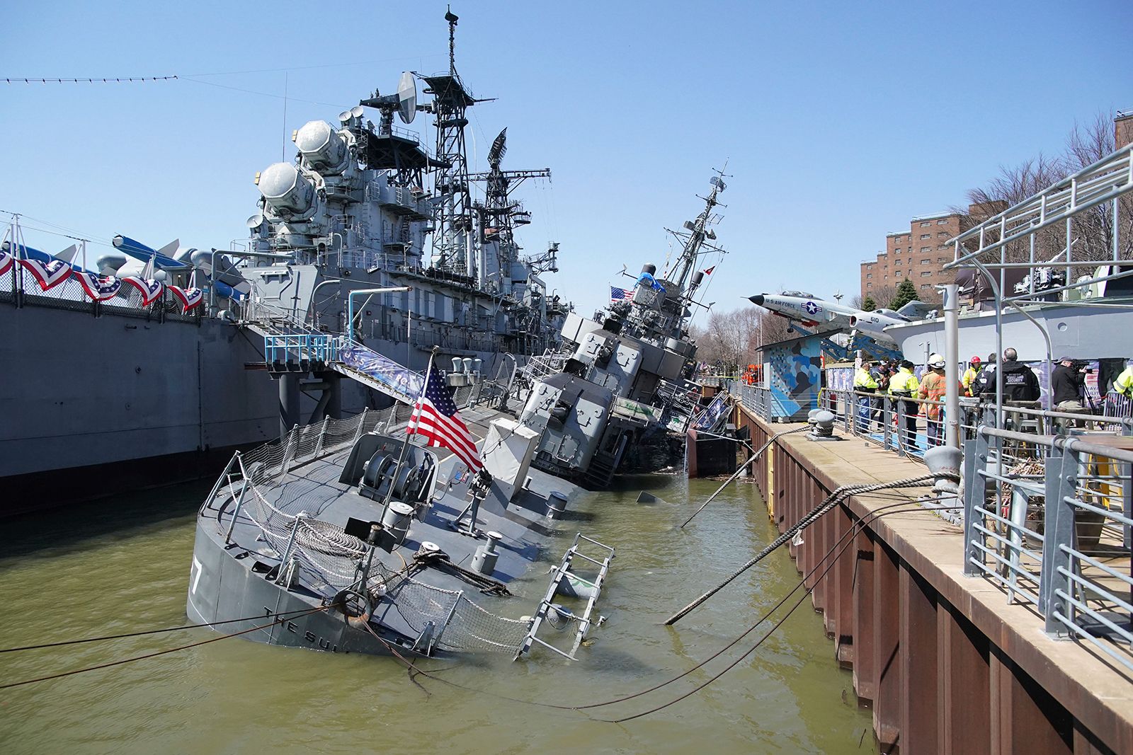 USS The Sullivans, a World War II-era naval destroyer, sinks onto its side in Lake Erie.