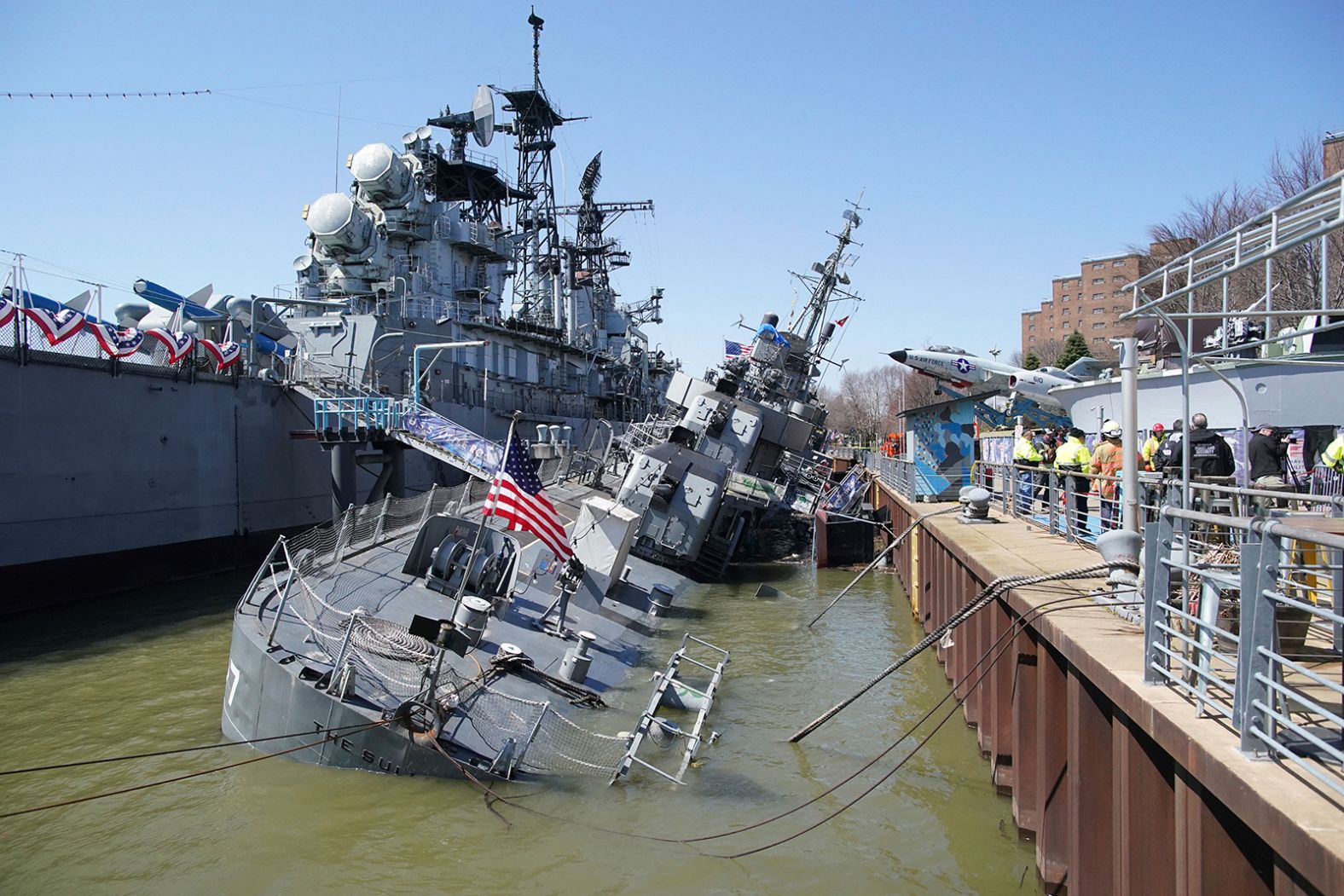 USS The Sullivans, a World War II-era naval destroyer on exhibit in Buffalo, New York, <a href="index.php?page=&url=https%3A%2F%2Fwww.cnn.com%2F2022%2F04%2F14%2Fus%2Fbuffalo-uss-the-sullivans-sinking%2Findex.html" target="_blank">sinks onto its side in Lake Erie.</a> A serious hull breach occurred on Wednesday, April 13, according to a statement from the park.