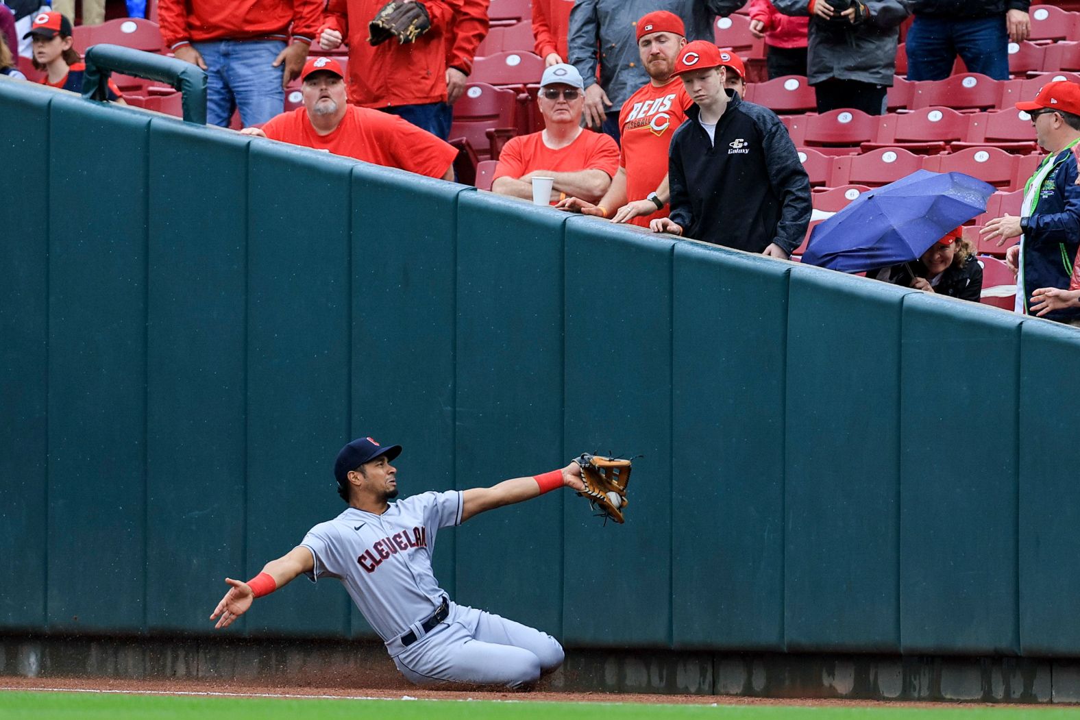 Cleveland's Oscar Mercado slides to catch a foul ball during a Major League Baseball game in Cincinnati on Wednesday, April 13.