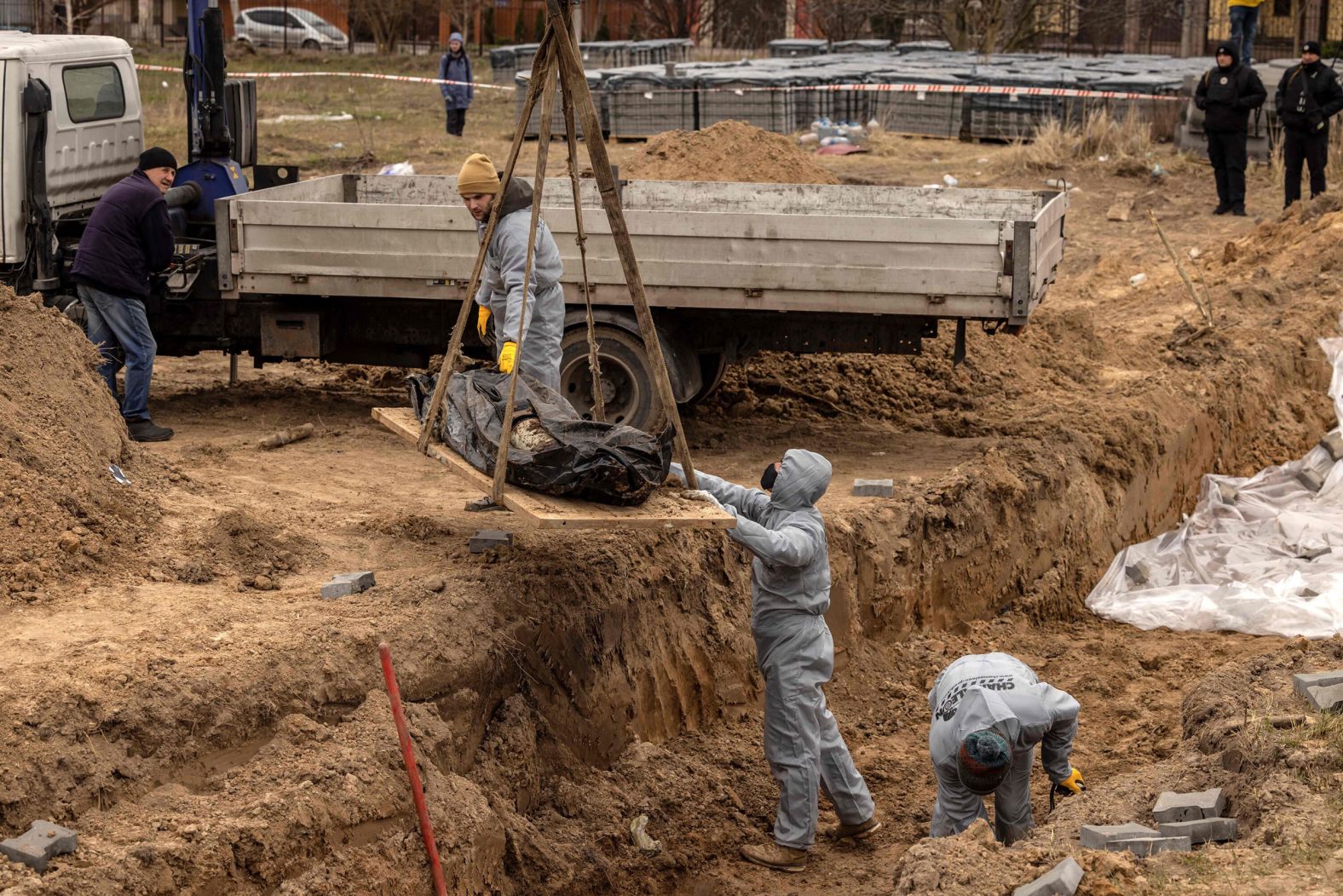 Workers exhume bodies at a site in Bucha, Ukraine, on Wednesday, April 13. The bodies of civilians in Bucha, a suburb of Kyiv, <a href="index.php?page=&url=https%3A%2F%2Fwww.cnn.com%2F2022%2F04%2F03%2Feurope%2Fbucha-ukraine-civilian-deaths-intl%2Findex.html" target="_blank">sparked international outrage</a> and raised the urgency of ongoing investigations into alleged Russian war crimes. Ukrainian President Volodymyr Zelensky called on Russian leaders to be held accountable for the actions of the nation's military. The Russian Ministry of Defense, without evidence, claimed the extensive footage of Bucha was "fake."