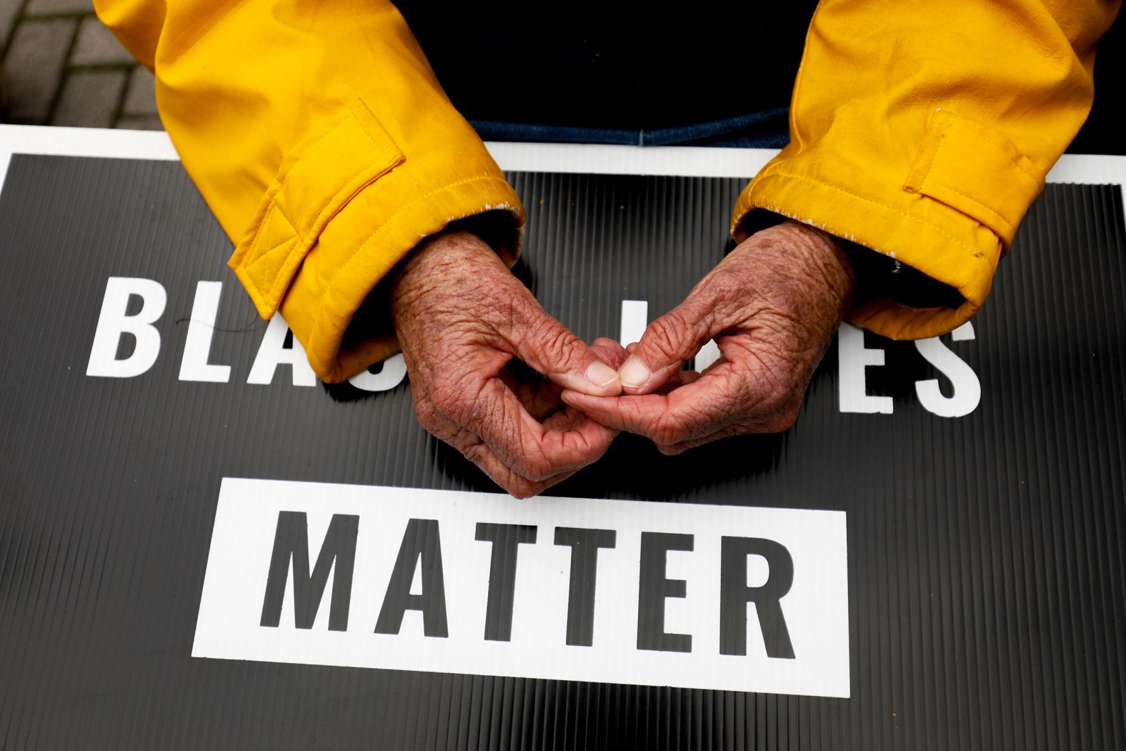 A protester in Grand Rapids, Michigan, takes part in a demonstration Wednesday, April 13, over the police shooting of Patrick Lyoya. Police in Grand Rapids <a href="index.php?page=&url=https%3A%2F%2Fwww.cnn.com%2F2022%2F04%2F13%2Fus%2Fmichigan-grand-rapids-police-video-patrick-lyoya%2Findex.html" target="_blank">have released several videos of an officer's encounter with Lyoya earlier this month,</a> including two that show the fatal shot during a struggle after a traffic stop.