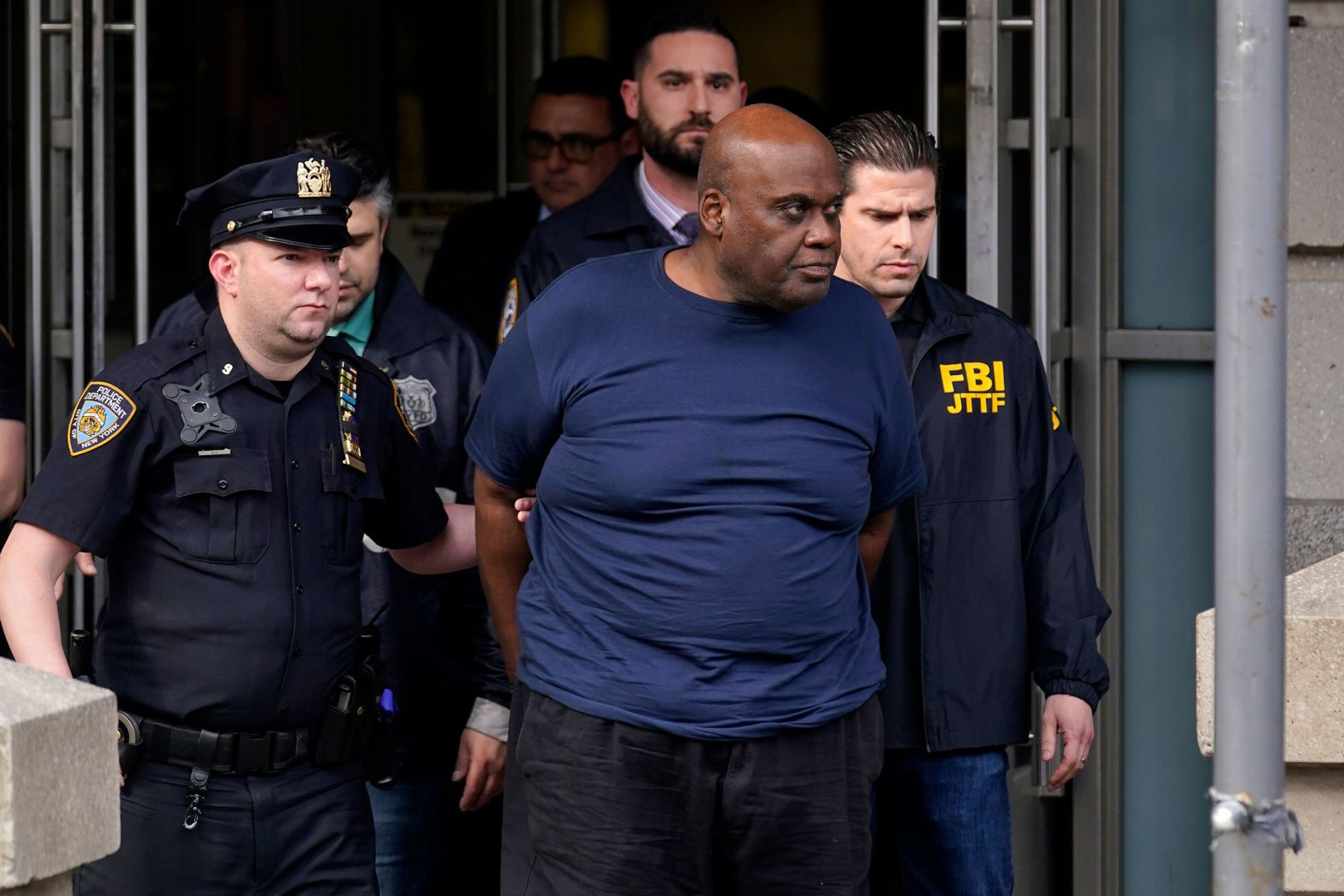 Law enforcement officials lead subway shooting suspect Frank James away from a police station in New York on Wednesday, April 13. James was charged in federal court with violating a law that prohibits terrorist and other violent attacks against a mass transportation system, according to Breon Peace, US Attorney for the Eastern District of New York. <a href="index.php?page=&url=https%3A%2F%2Fwww.cnn.com%2F2022%2F04%2F14%2Fus%2Fbrooklyn-subway-shooting-thursday%2Findex.html" target="_blank">James appeared in court Thursday</a> and did not enter a plea.