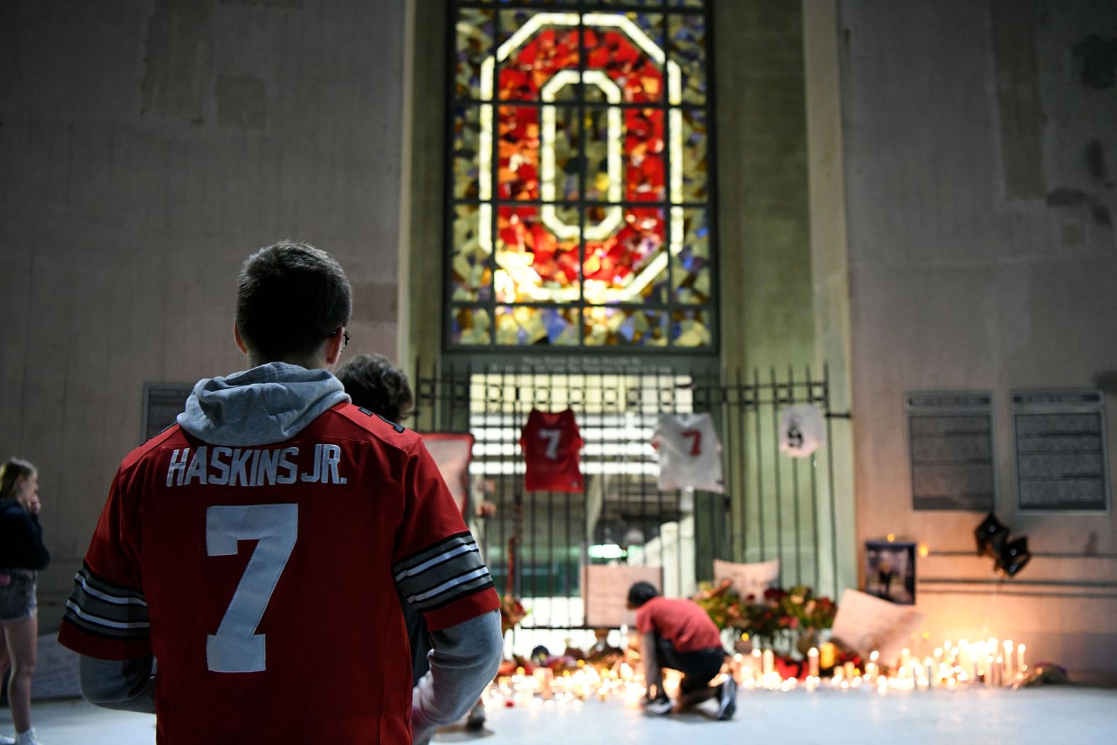 Fans in Columbus, Ohio, attend a candlelight vigil that was held at Ohio Stadium for NFL quarterback Dwayne Haskins on Tuesday, April 12. Haskins, a former star at the Ohio State University, <a href="index.php?page=&url=https%3A%2F%2Fwww.cnn.com%2F2022%2F04%2F11%2Fus%2Fdwayne-haskins-death-what-we-know%2Findex.html" target="_blank">was fatally struck by a dump truck</a> April 9 as he tried to cross a highway on foot in South Florida, authorities said. He was 24 years old.