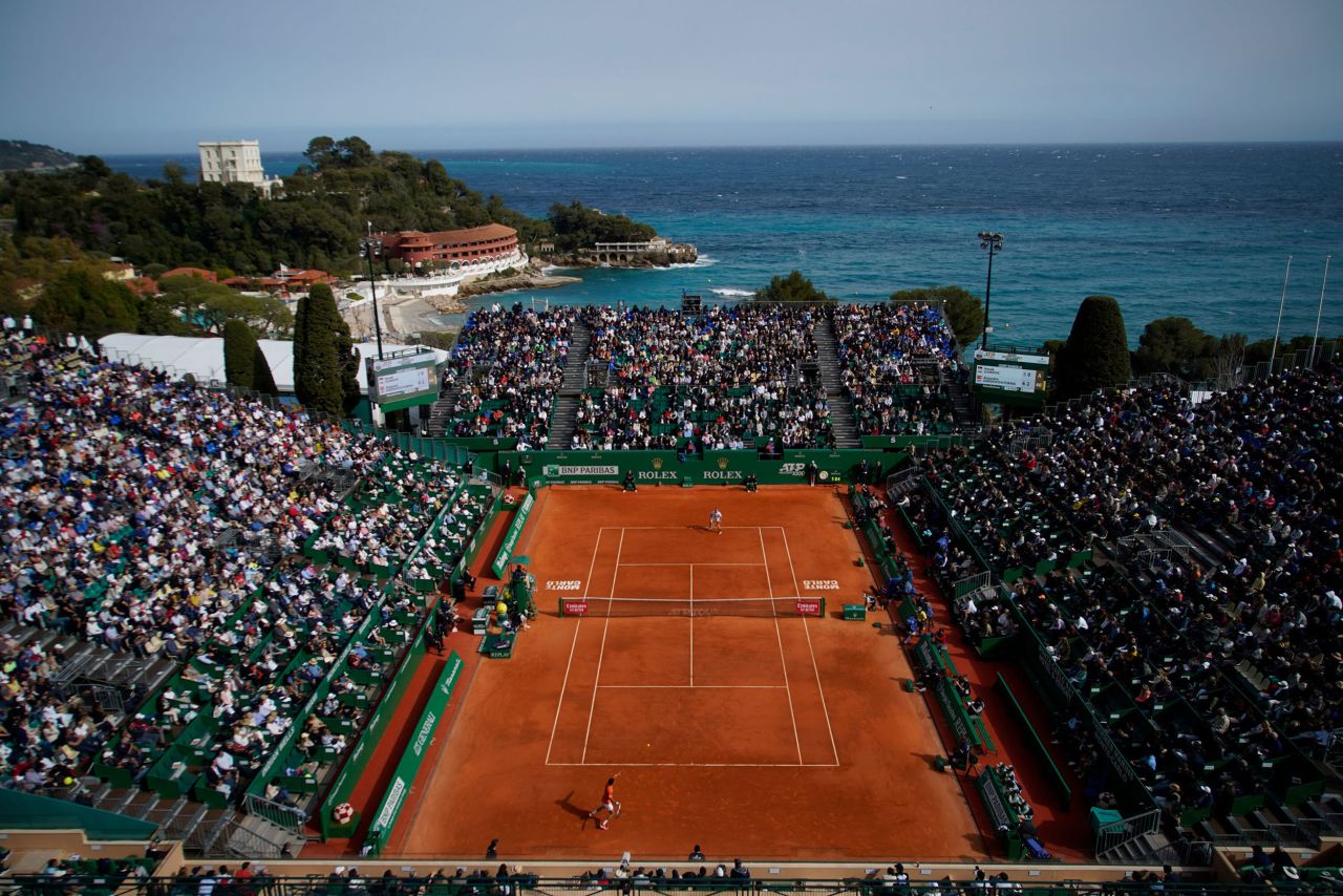 Novak Djokovic, bottom, returns the ball to Alejandro Davidovich Fokina during a second-round match at the Monte Carlo Masters in Monaco on Tuesday, April 12. It was Djokovic's first match since February, and <a href="https://www.cnn.com/2022/04/12/tennis/novak-djokovic-lose-monte-carlo-spt-intl/index.html" target="_blank">he lost.</a> Djokovic, the world's No. 1 tennis player, has missed several tournaments this year because of his Covid-19 vaccination status. <a href="http://www.cnn.com/2022/04/08/world/gallery/photos-this-week-march-31-april-7/index.html" target="_blank">See last week in 35 photos.</a> 