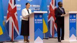 Britain's Home Secretary Priti Patel, left, speaks to the media with Rwanda's Minister of Foreign Affairs Vincent Biruta, right, after signing what the two countries called an "economic development partnership" in Kigali, Rwanda Thursday, April 14, 2022. Britain's Conservative government has struck a deal to send some asylum-seekers thousands of miles away to Rwanda, a move that British opposition politicians and refugee groups condemned as inhumane, unworkable and a waste of public money.
