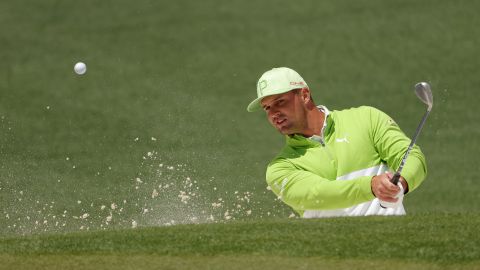 DeChambeau plays his shot from the bunker on the second hole during the second round of The Masters.