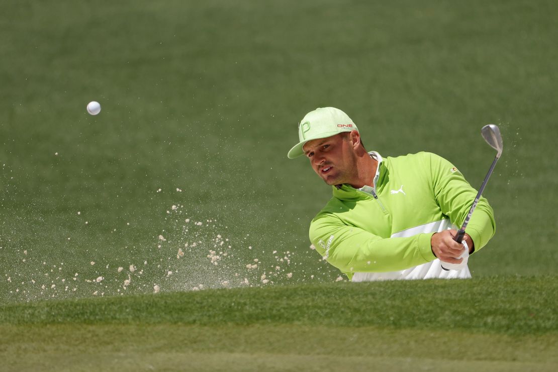 DeChambeau plays his shot from the bunker on the second hole during the second round of The Masters.