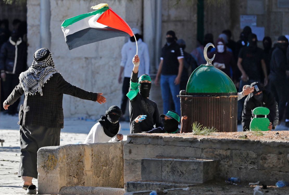 Palestinian demonstrators clash with Israeli police at Jerusalem's al-Aqsa mosque compound on April 15, 2022.