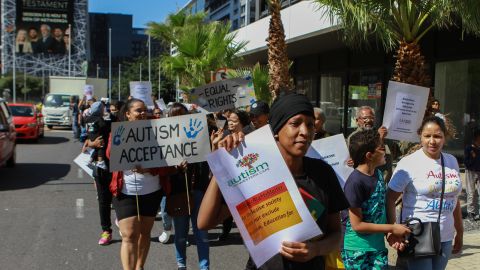 A group marches this month in Cape Town, South Africa, to demand  services and support for families with children who are autistic.