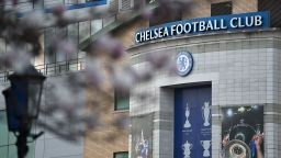 Chelsea's stadium, Stamford Bridge is seen through trees in London on March 10, 2022, as Chelsea's Russian owner Roman Abramovich was  hit with a UK assets freeze and travel ban, throwing his plans to sell the European and world club champions into disarray. - Chelsea shirt sponsor Three announced Thursday it was suspending its deal with the Premier League club after the UK government slapped sanctions on Russian owner Roman Abramovich. 