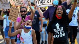 Cristiana Gant, 9, left, shouts alongside fellow activists during a protest in Garden City, New York, against police brutality in the wake of the death of George Floyd, on June 23, 2020. 