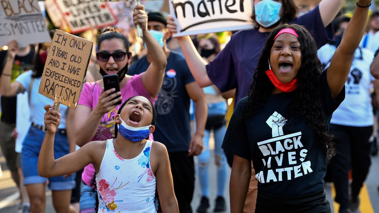 Young activists protest in June 2020 in Garden City, New York, following George Floyd's death by police. 