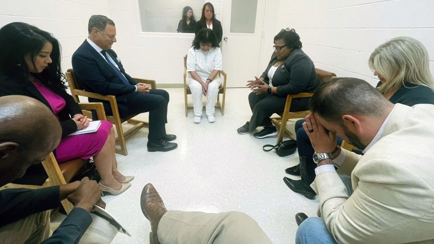In this April 6, 2022 photo provided by Texas state Rep. Jeff Leach, Texas death row inmate Melissa Lucio, dressed in white, leads a group of seven Texas lawmakers in prayer in a room at the Mountain View Unit in Gatesville, Texas. The lawmakers visited Lucio to update her about their efforts to stop her April 27 execution. The lawmakers say they are troubled by Lucio's case and believe her execution should be stopped as there are legitimate questions about whether she is guilty.