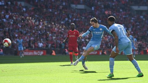 Grealish shoots and scores City's first goal during the English FA Cup semifinal against Liverpool on April 16, 2022. 