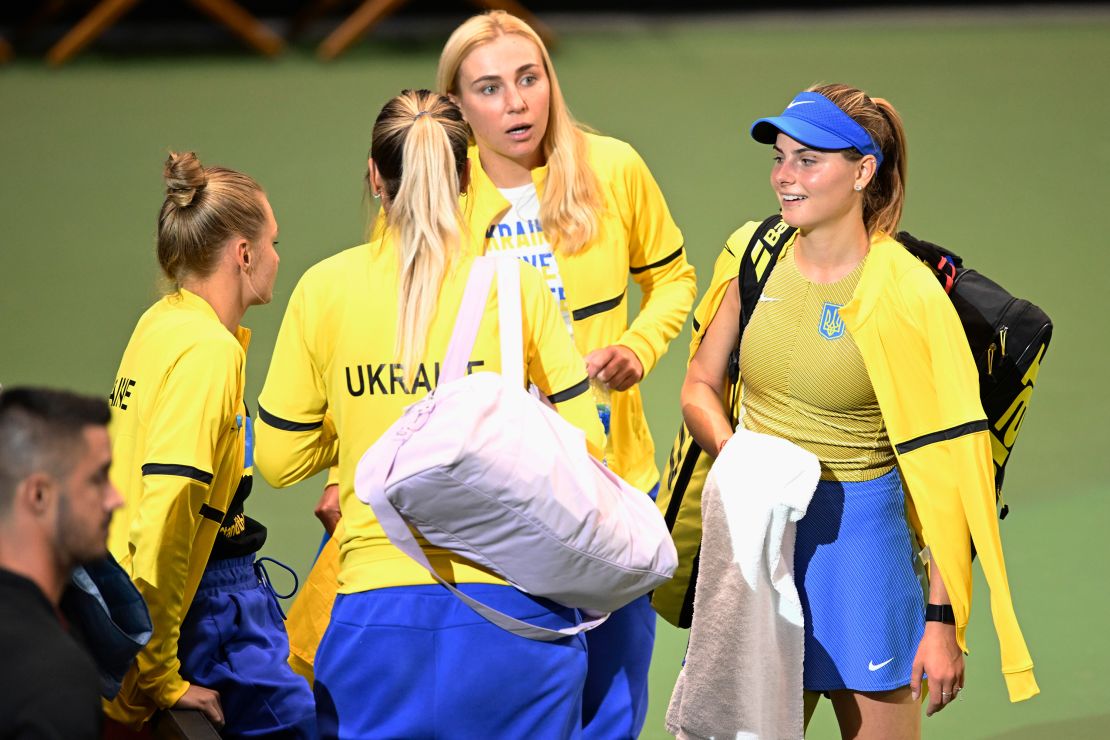 Katarina Zavatska talks with her team following her loss to American Jessica Pegula in the first round of the 2022 Billie Jean King Cup qualifier.