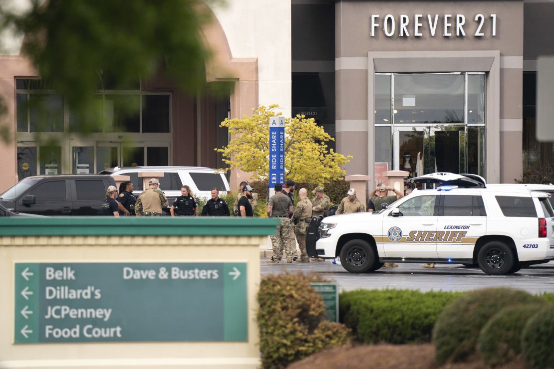 Law enforcement gather outside Columbiana Centre mall Saturday.