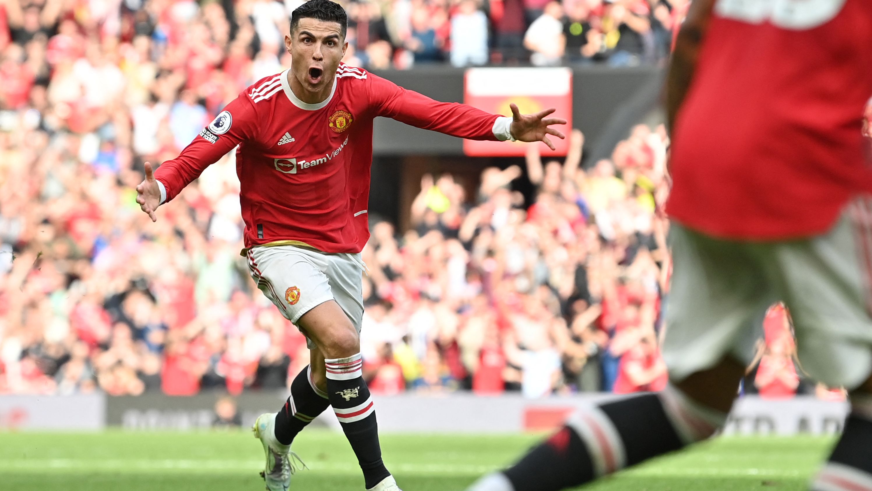 Manchester United's Portuguese striker Cristiano Ronaldo celebrates after scoring his third goal against Norwich.