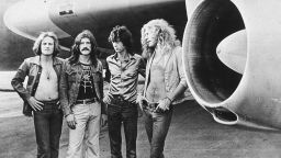British rock band Led Zeppelin, (left - right): John Paul Jones, John Bonham (1948 - 1980), Jimmy Page and Robert Plant, pose in front of an their private airliner The Starship, 1973. (Photo by Hulton Archive/Getty Images)