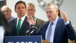 Florida Department of Education Commissioner Richard Corcoran, right, briefly discusses the impact of Bill SB 1048 alongside Gov. Ron DeSantis at a news conference on March 17. 