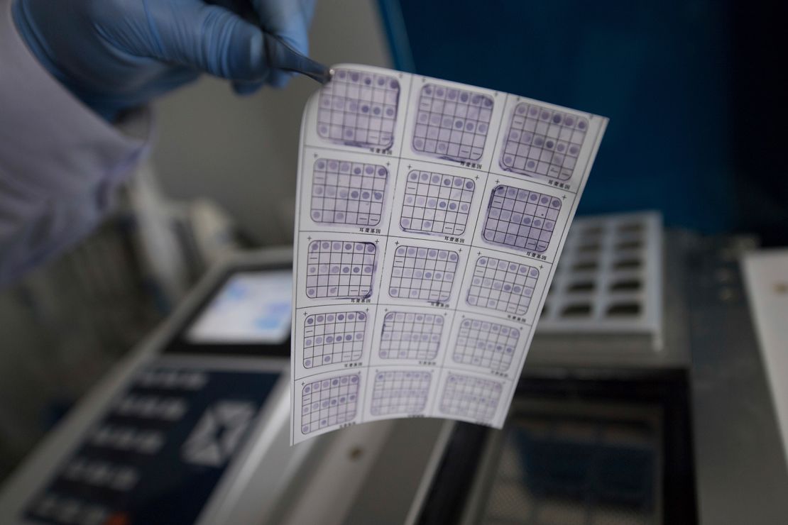 A medical worker performs genetic testing on embryos at the Shanxi Province Reproductive Science Institute in Taiyuan, China, on November 29, 2018.