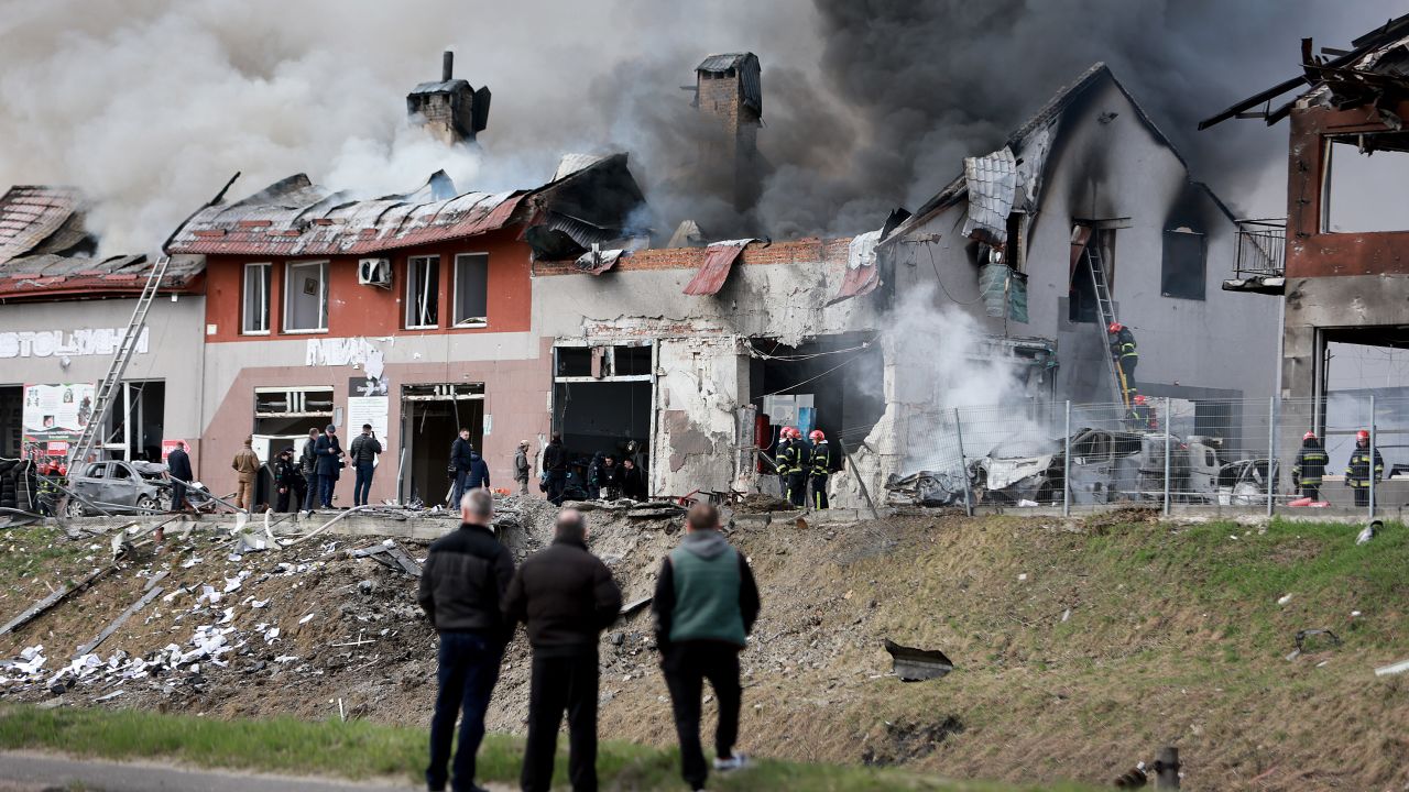 LVIV, UKRAINE - APRIL 18: Firefighters battle a blaze after a civilian building was hit by a Russian missile on April 18, 2022 in Lviv, Ukraine. At least six people were killed and eight wounded in missile strikes in different areas of the city, according to the governor. (Photo by Joe Raedle/Getty Images)