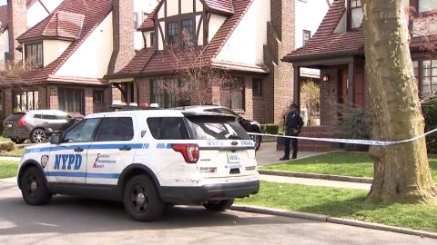 Police investigated at the Queens home of a 51-year-old woman whose body was found a half-mile away in a duffel bag.