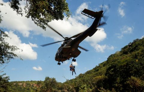 A search-and-rescue team carries out an airlift near Durban on Tuesday, April 19.