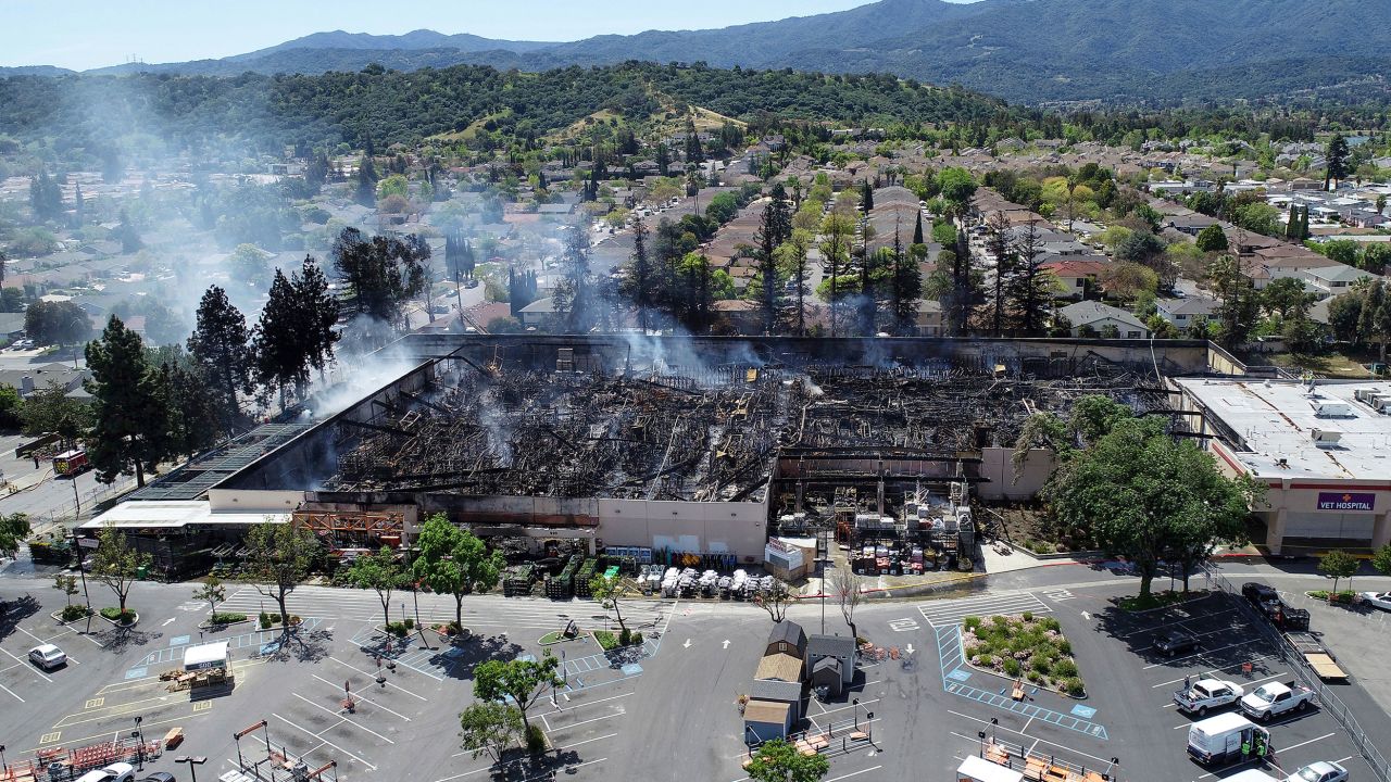 Smoke rises from an extinguished fire at the Home Depot off Blossom Hill Road in San Jose, Calif., on Sunday, April 10, 2022.
