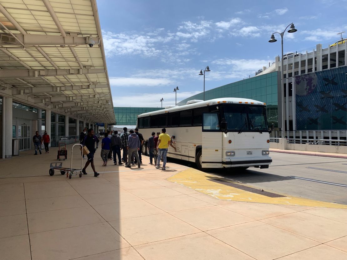 Buses like these drop off hundreds of migrants at the San Antonio airport every day. Inside the airport terminal there are phone charging stations for migrants to charge their devices. 