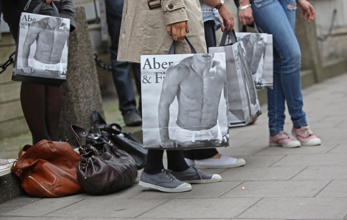 Shoppers hold Abercrombie & Fitch shopping bags outside the store in London, UK, in 2010.