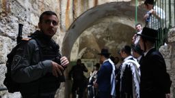 Jewish settlers escorted by Israeli forces enter Al-Aqsa Mosque compound after police drive out Palestinian worshippers following a morning prayer, in Jerusalem on April 18.