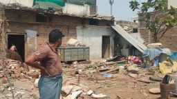 Shahdullah Baig looks at what's left of his home after state authorities demolished it following communal violence in Khargone, Madhya Pradesh