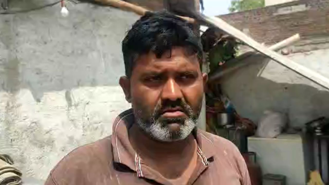 Shahdullah Baig stands in front of his demolished home in Khargone, Madhya Pradesh.