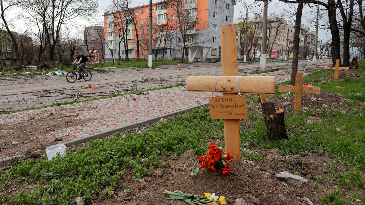 A view shows graves of civilians killed during the Ukraine-Russia conflict by the roadside in Mariupol on April 18, 2022.