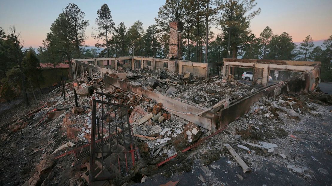 A house near Ruidoso, New Mexico, continues to smolder following the McBride Fire.  