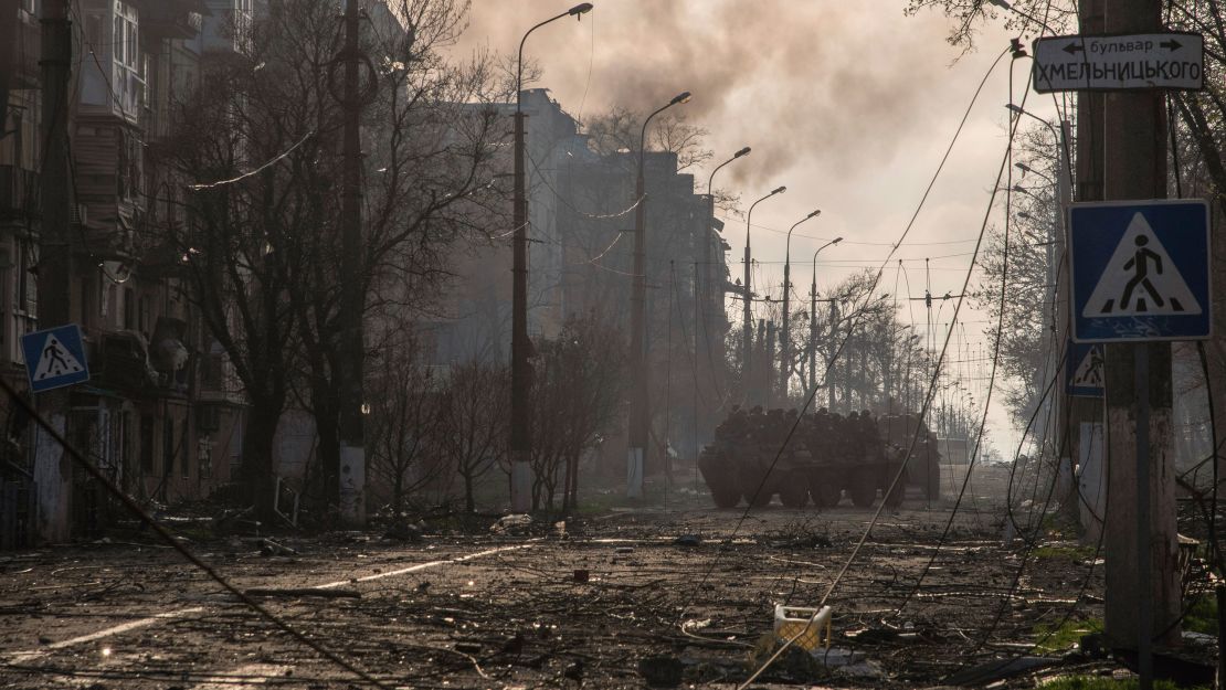 Armored personnel carriers of the so-called Donetsk People's Republic drive through a street in Mariupol on April 18.