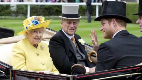 Prince Harry pictured with his grandparents Queen Elizabeth II and Prince Philip, the Duke of Edinburgh in 2016 in Ascot, England.